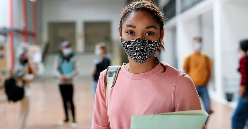 Teenager with covid mask on