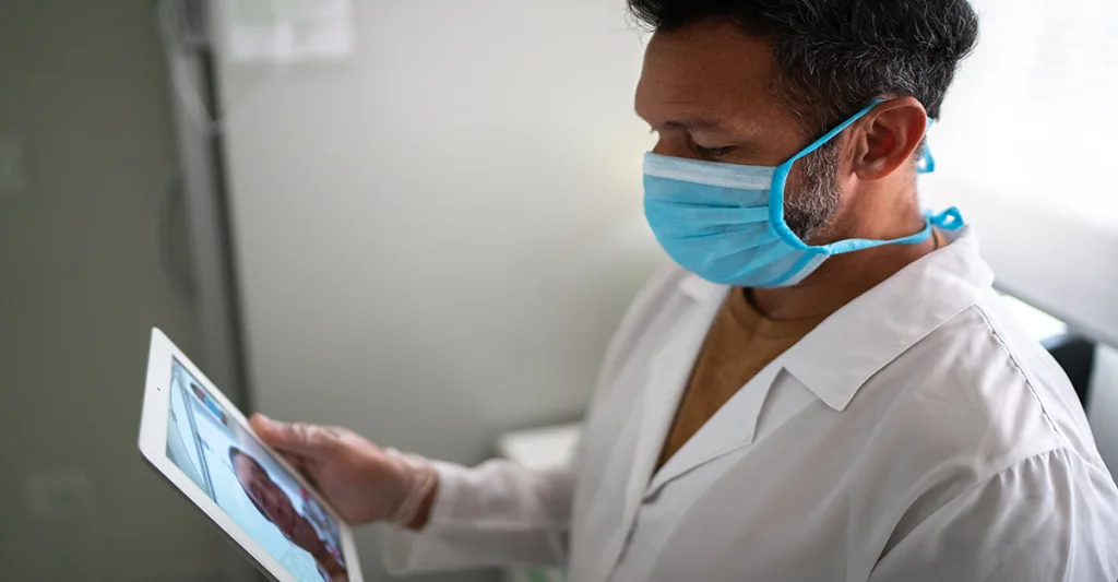 Doctor-or-nurse-on-tele-health-call-on-tablet-FB-GettyImages-1277768934.jpg