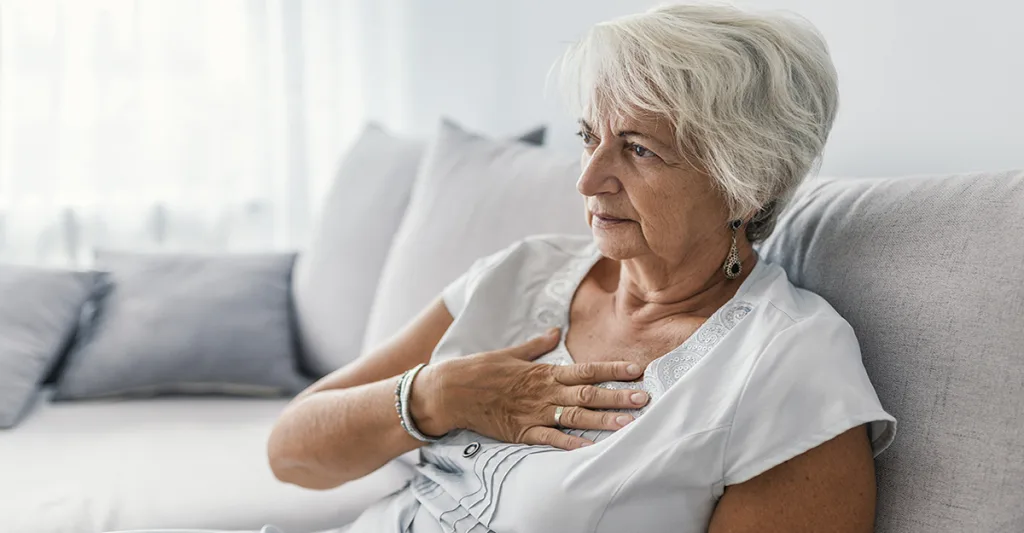 Older-woman-holding-chest-FB-GettyImages-997797726.jpg