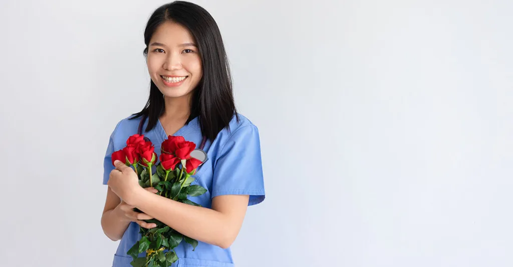 Nurse-holding-flowers-FB-GettyImages-1095737670.jpg