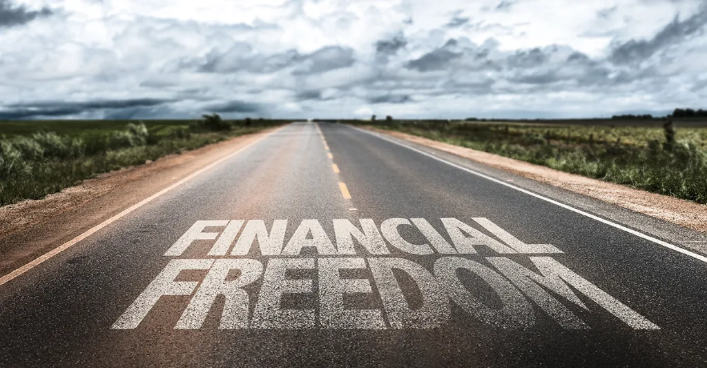 Financial freedom written on the road