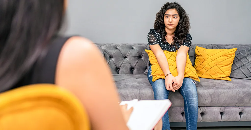 Young-teen-girl-in-counseling-session-FB-GettyImages-1333213306.jpg