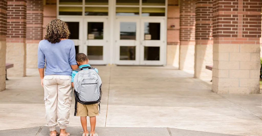 Mom and son outside of school