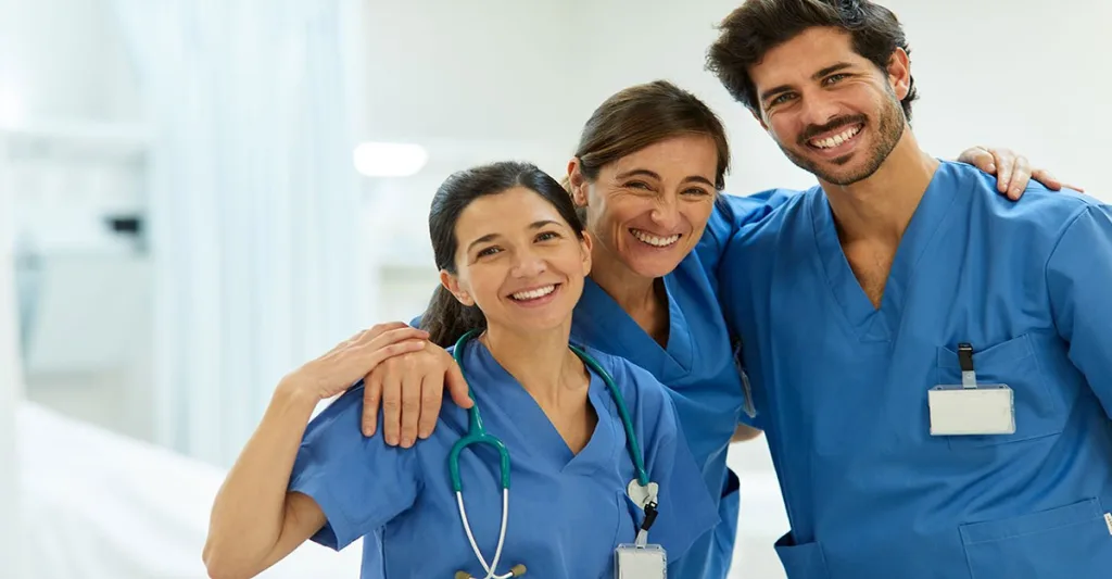 Three smiling nurses