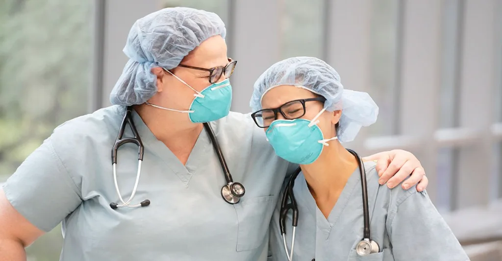 Nurses-hugging-GettyImages-1293315889-web.jpg