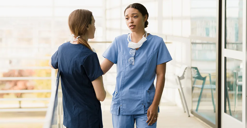 2-nurses-talking-GettyImages-1368253366.jpg
