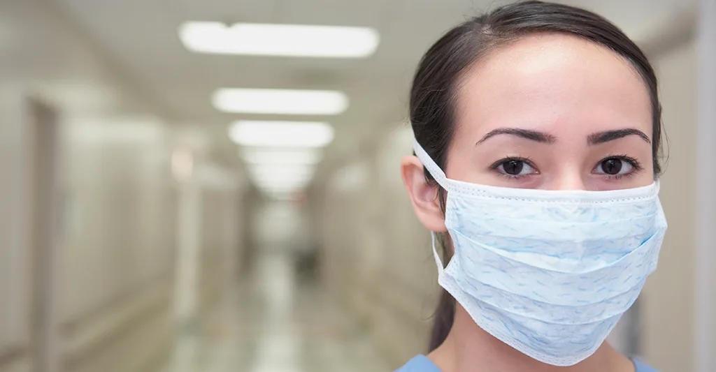 Nurse-wearing-mask-GettyImages-73773048.jpg