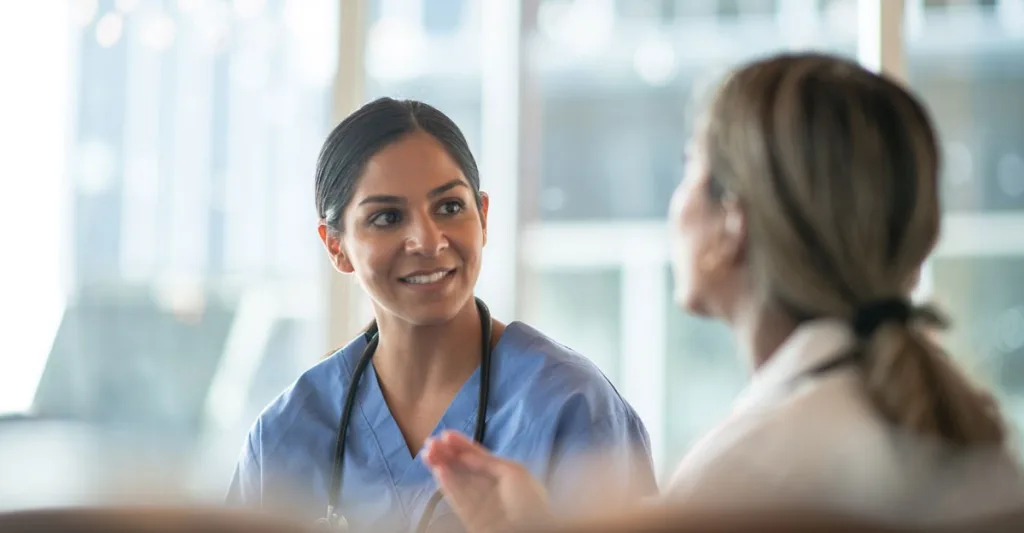 Nurse leader talking to a nurse