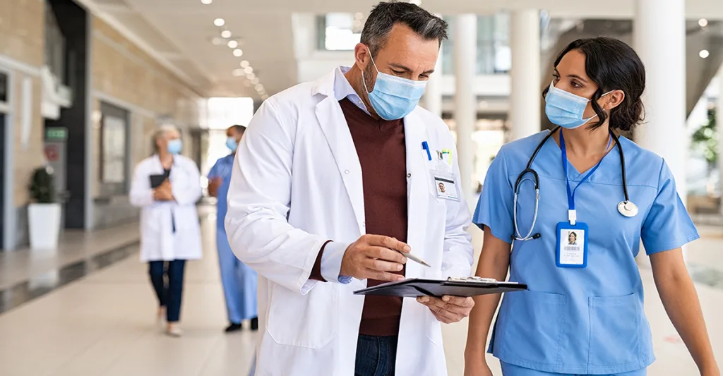 Doctor talking to a nurse