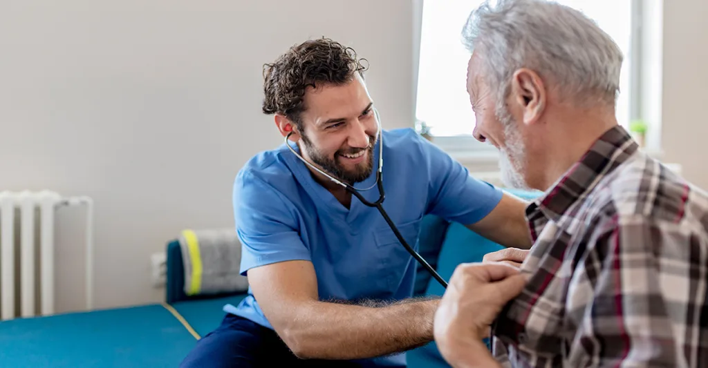 Male-nurse-with-patient-GettyImages-1161267086.jpg