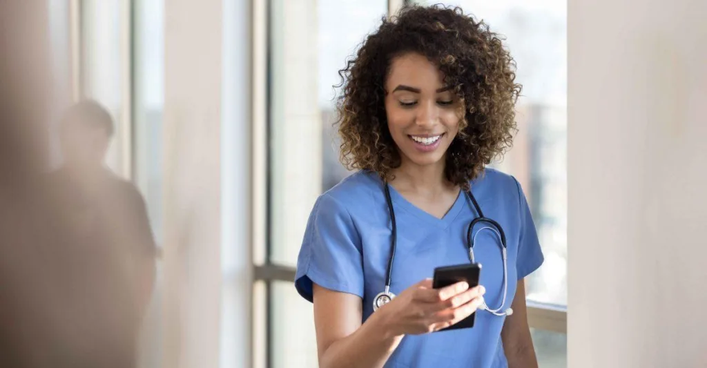 Nurse looking at her cellphone