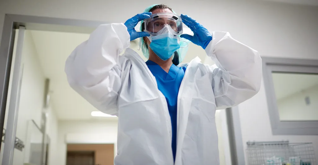 Nurse-wearing-PPE-GettyImages-1255589507.jpg