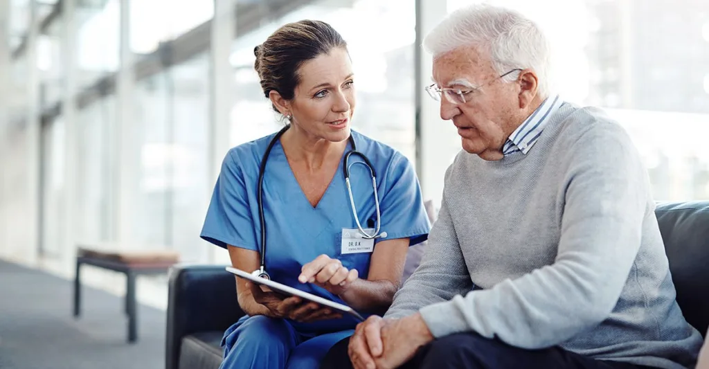 Nurse-with-patient-GettyImages-1147479334.jpg