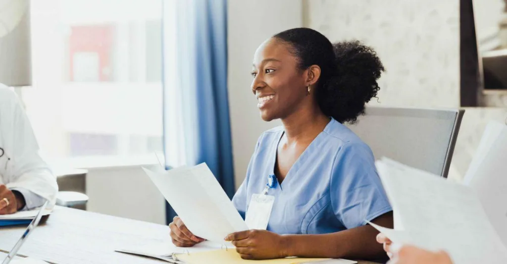 Nurse leader at conference room table