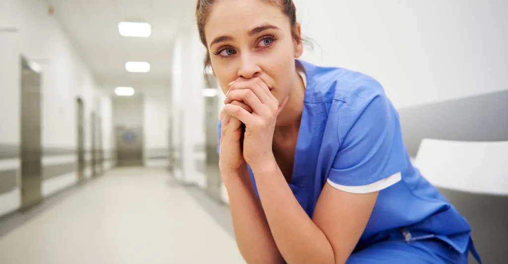 Upset nurse in hallway