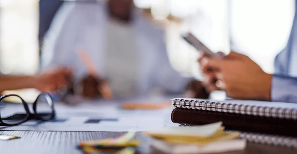 Two people at a table with papers out