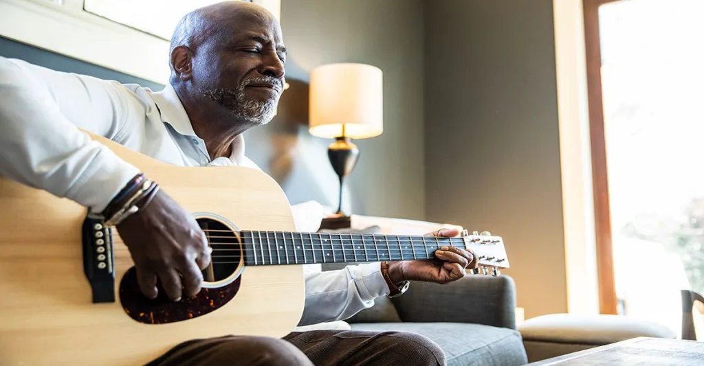 Man-playing-guitar-GettyImages-1380716350.jpg