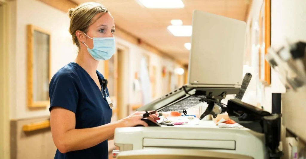 Nurse charting at computer