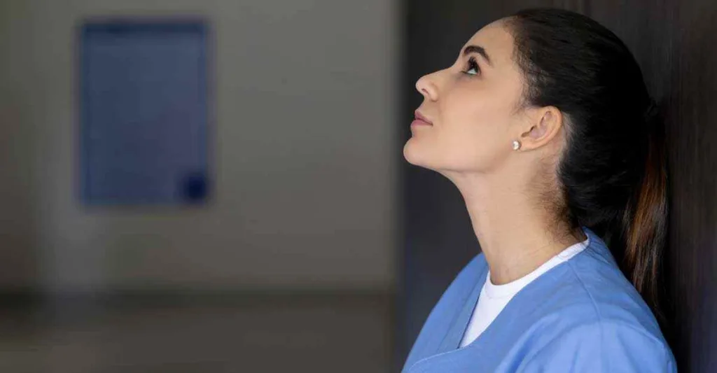 Nurse looking up to the ceiling