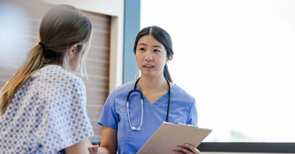 Nurse and patient talking