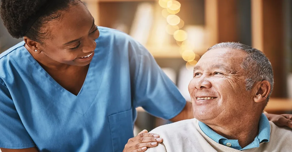 Nurse smiling with patient