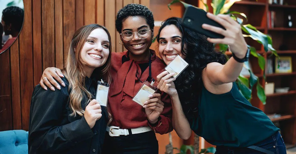 Three woman at a conference