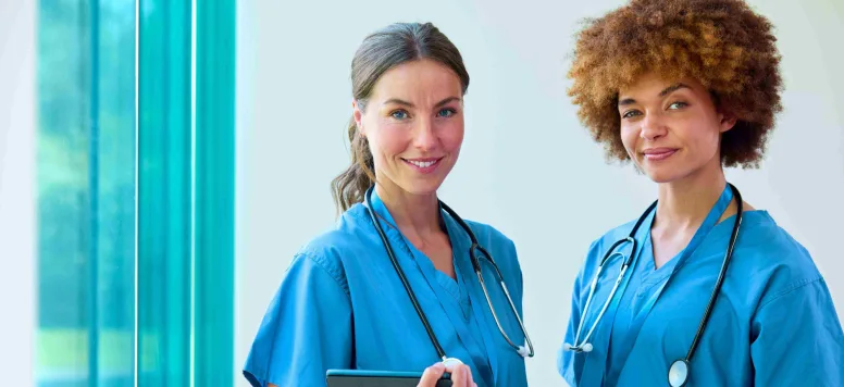 Two nurses wearing stethoscopes