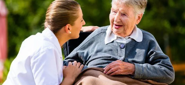 Nursing comforting patient outside