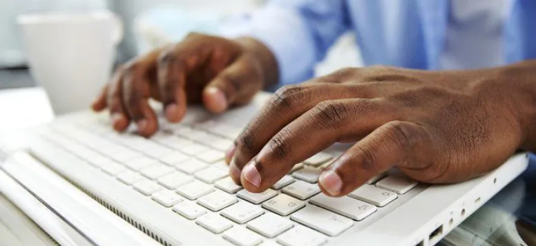 Nurse typing on a keyboard