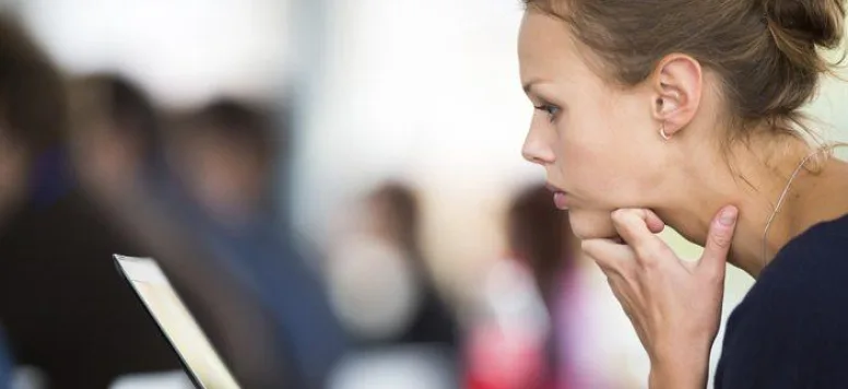 Nurse studying at a laptop