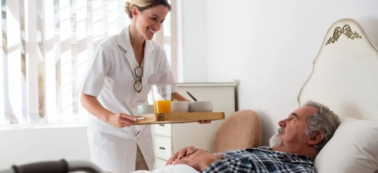 Nurse-patient-food-tray-GettyImages-837336882.jpg