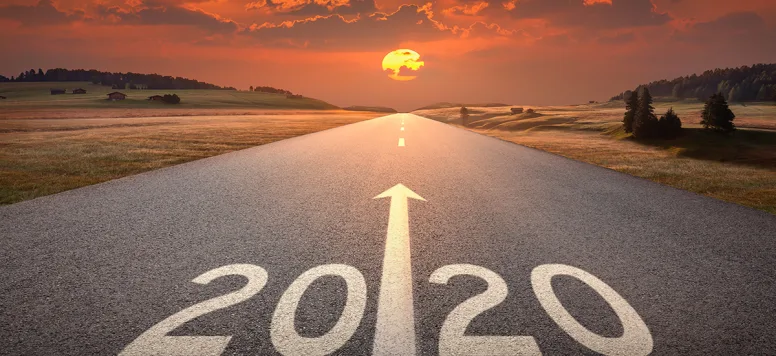 Sunrise over a road saying 2020