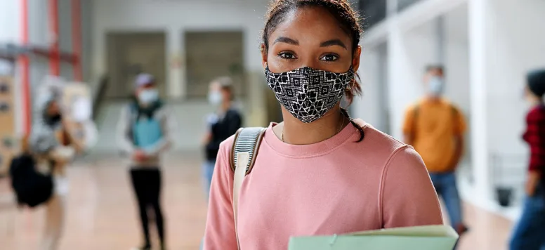 Teenage-with-covid-19-mask-FB-GettyImages-1284584602.jpg