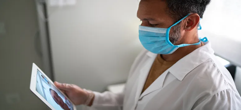 Doctor-or-nurse-on-tele-health-call-on-tablet-FB-GettyImages-1277768934.jpg