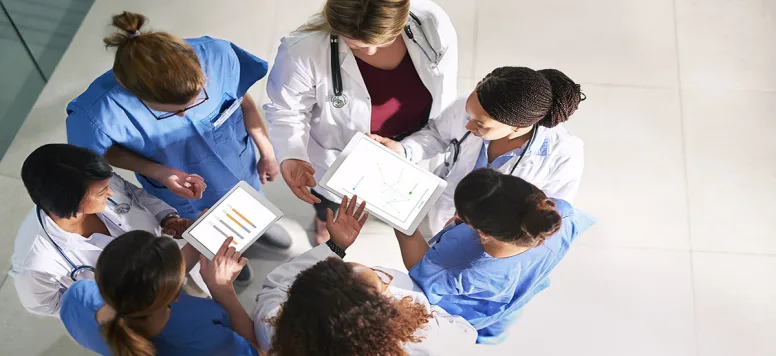 Nurses in a circle talking