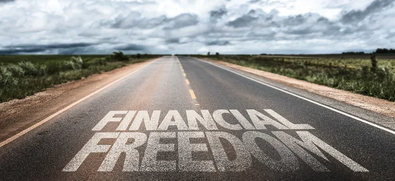 Financial freedom written on the road