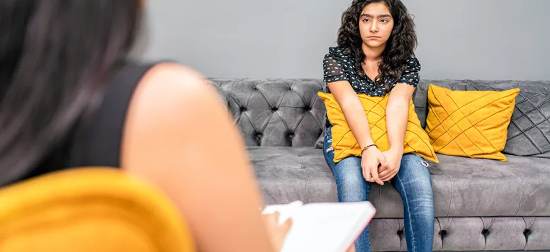 Young-teen-girl-in-counseling-session-FB-GettyImages-1333213306.jpg