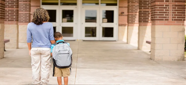 Mom and son outside of school