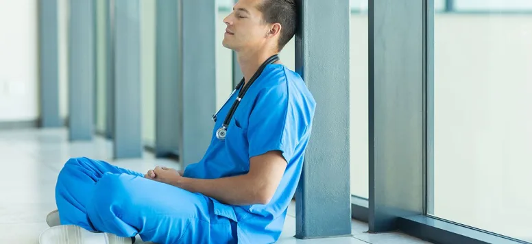 Male-nurse-resting-or-meditating-GettyImages-483804382.jpg