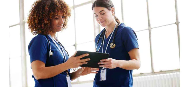 two-women-looking-at-a-clipboard.jpg