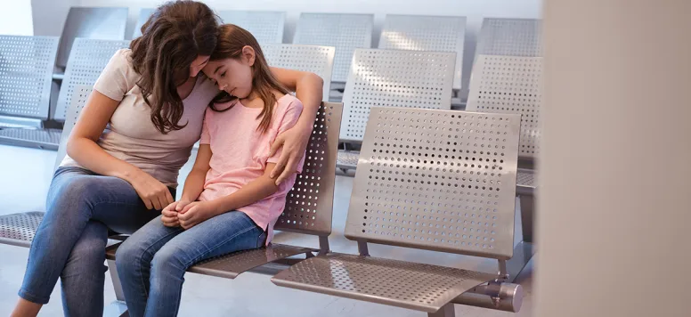 Mom-and-daughter-in-waiting-room-GettyImages-1136841462.jpg