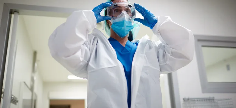 Nurse-wearing-PPE-GettyImages-1255589507.jpg