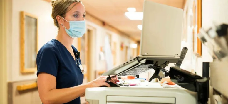 Nurse charting at computer