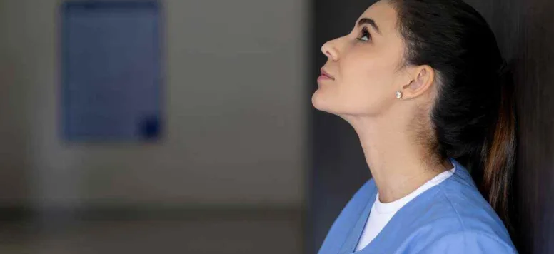 Nurse looking up to the ceiling