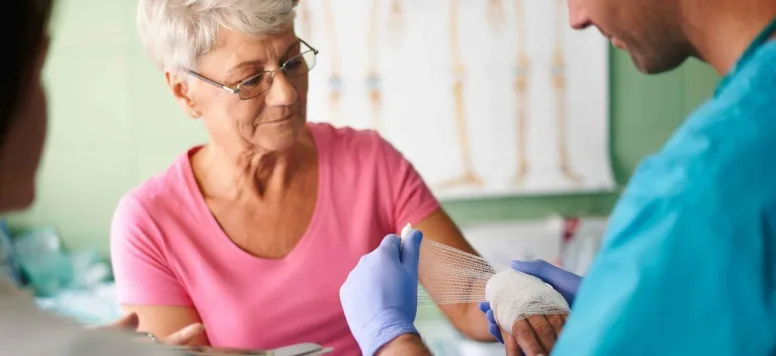 Nurse dressing a wound