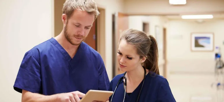 Nurses looking at tablet