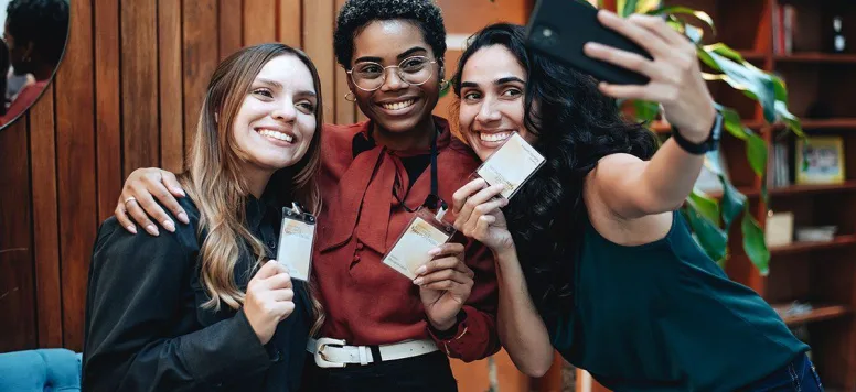 Three woman at a conference