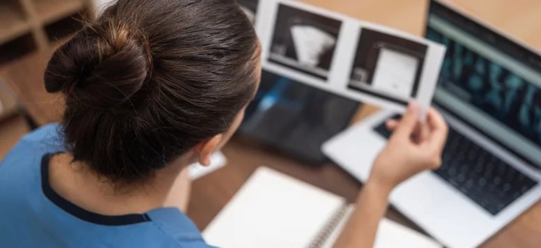 Nurse reviewing tests and charts