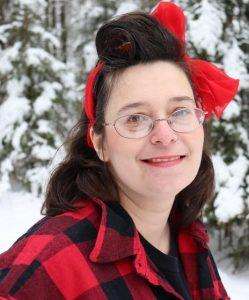 Photo of woman smiling in the snow wearing red