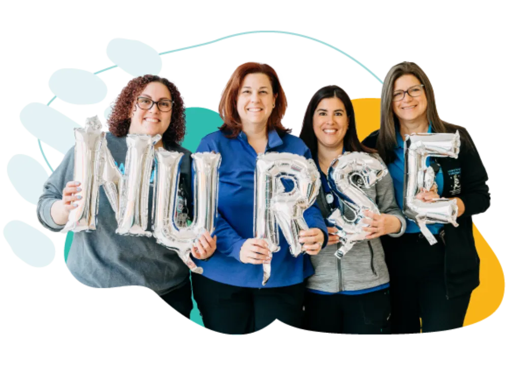 nurses holding balloons